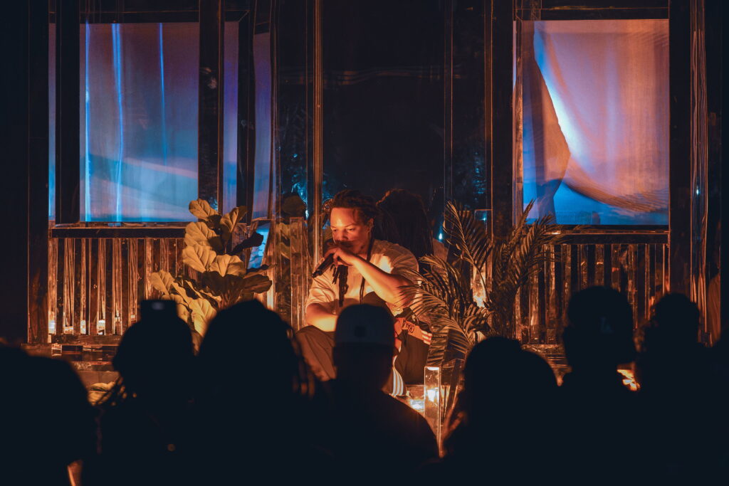 Domani performs in front of the reflective house stage set during the Succession Tour at The Echo in Los Angeles.