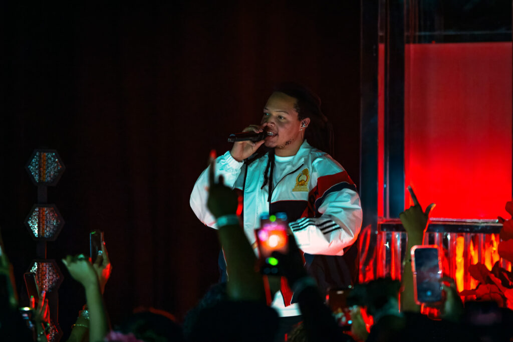 Domani-The-Echo-Los-Angeles-June-23-2026-by-Zharmaine-Boatman-IG-zharmaaaine-9 – The 824 Journal Singer performing on stage with microphone under red lighting, crowd raising phones and hands in the foreground.