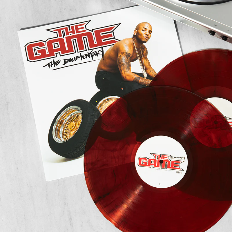 TheGame_Soundtrack.jpg – The 824 Journal Red translucent vinyl record partially covering The Game: The Documentary album cover.