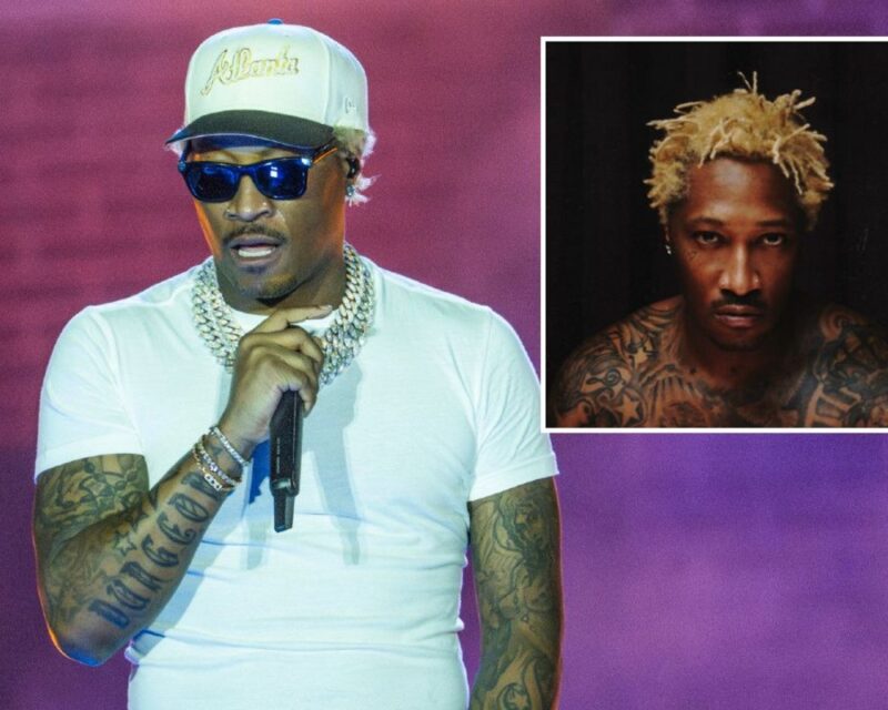 Hip-hop performer in a white T-shirt, cap, and sunglasses singing into a microphone on stage; inset shows a tattooed man with bleached blond hair in a bordered photo.