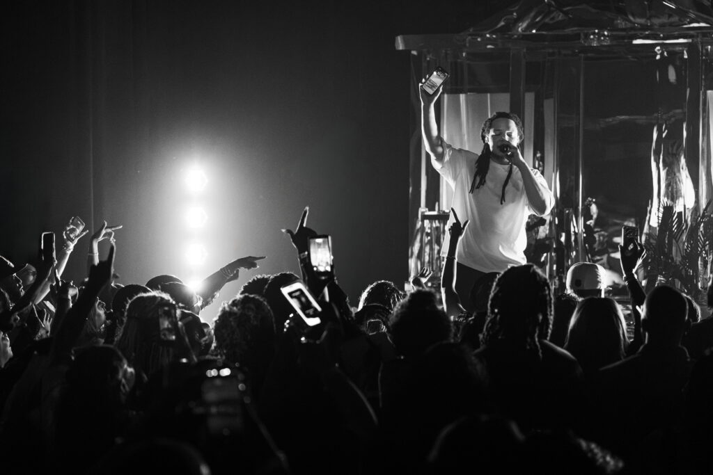 k-and-white photo of Domani performing before a packed crowd during the Succession Tour at The Echo in Los Angeles.