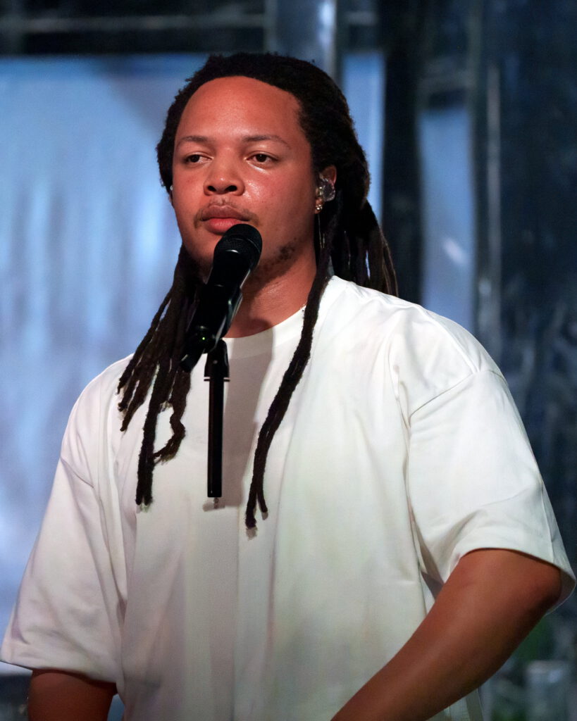 Close-up portrait of Domani performing at the microphone during the Succession Tour at The Echo in Los Angeles.