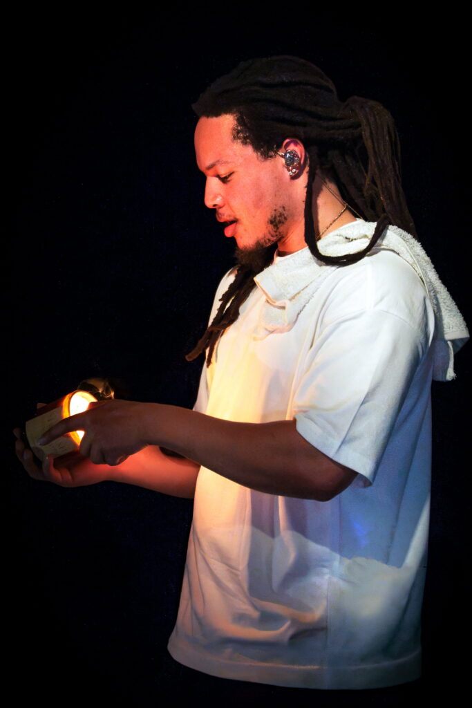 Domani holds a glowing lantern prop during an intimate performance on the Succession Tour at The Echo in Los Angeles.