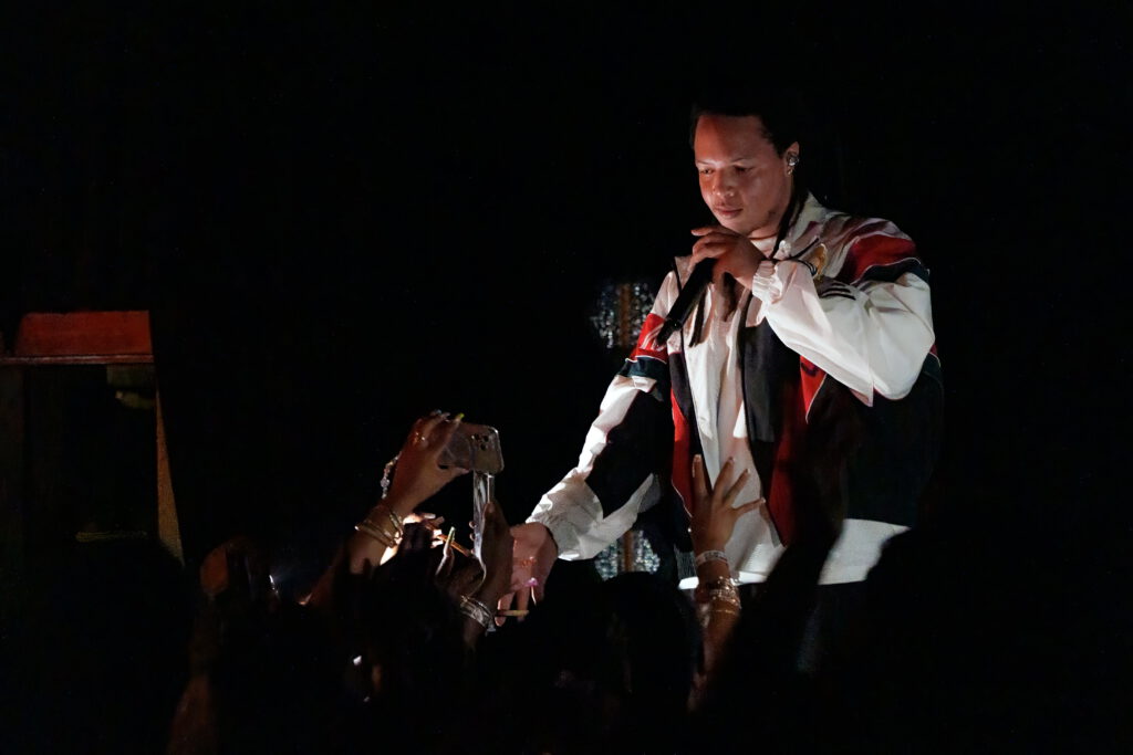 Domani reaches into the crowd to connect with fans during the Succession Tour performance at The Echo in Los Angeles.