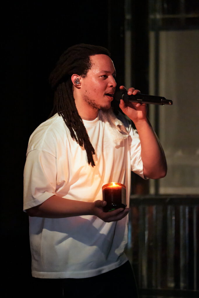Domani-The-Echo-Los-Angeles-June-23-2026-by-Zharmaine-Boatman-IG-zharmaaaine-26 – The 824 Journal Domani singing into a microphone while holding a lit candle at The Echo in Los Angeles.