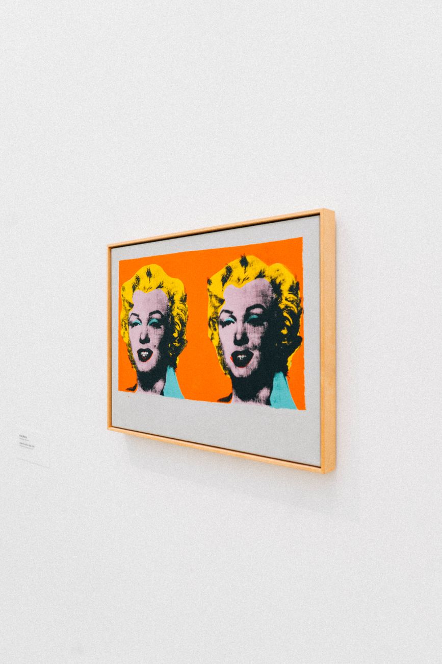 brown framed painting close up photography