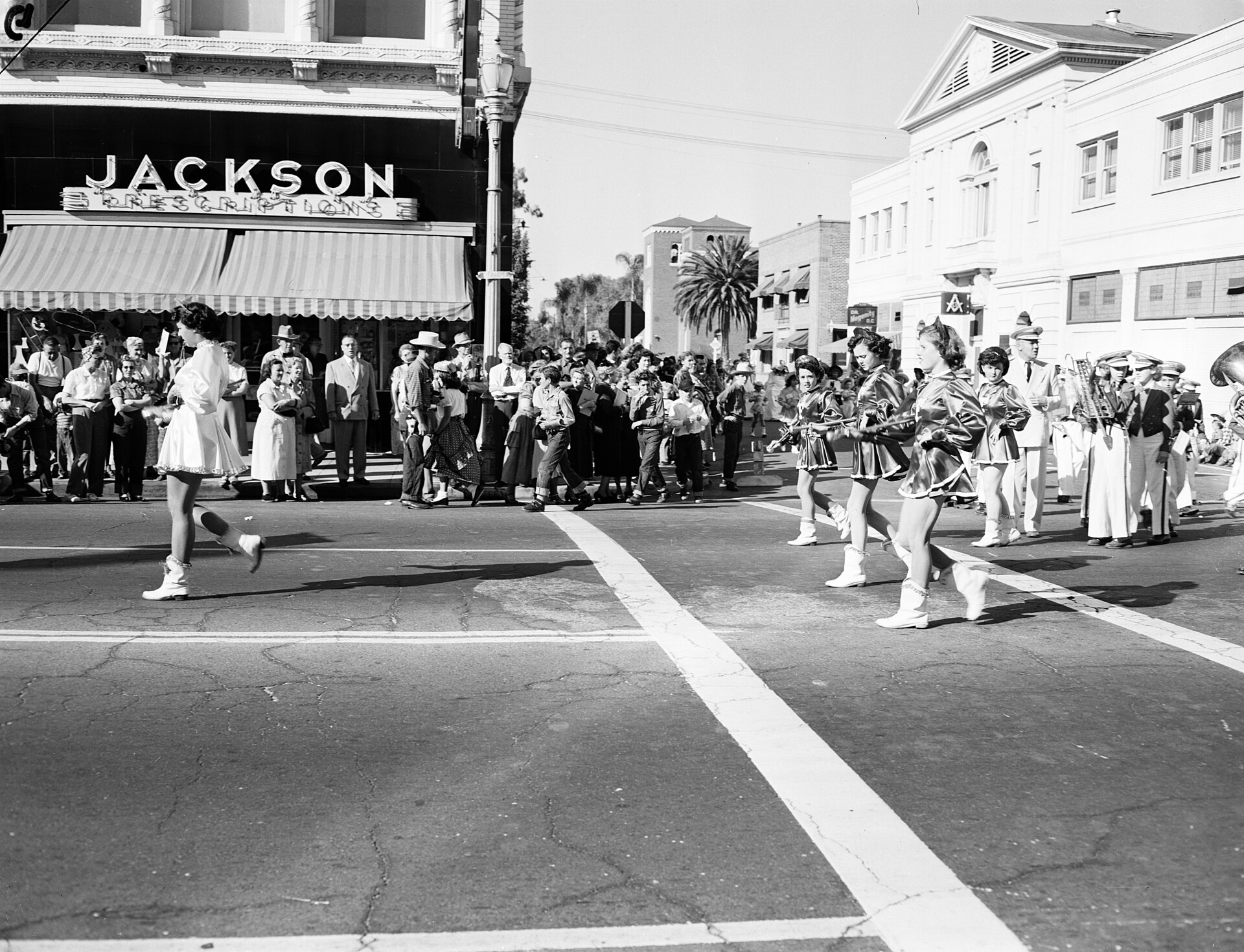 A marching band on a downtown street during the 1950 Anaheim Halloween Parade