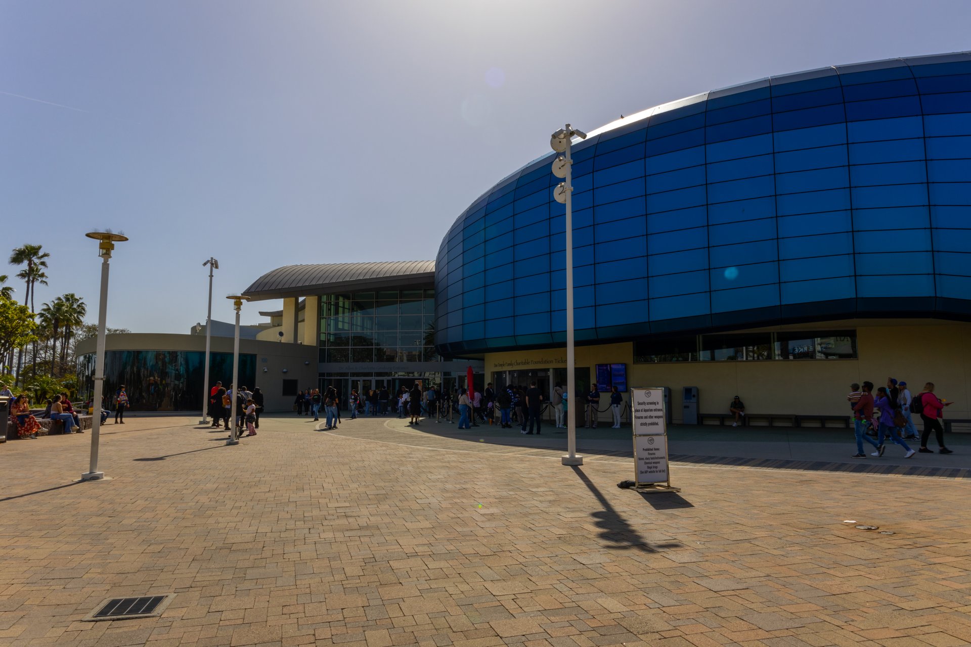 The wave-shaped exterior of the Aquarium of the Pacific in Long Beach during the day
