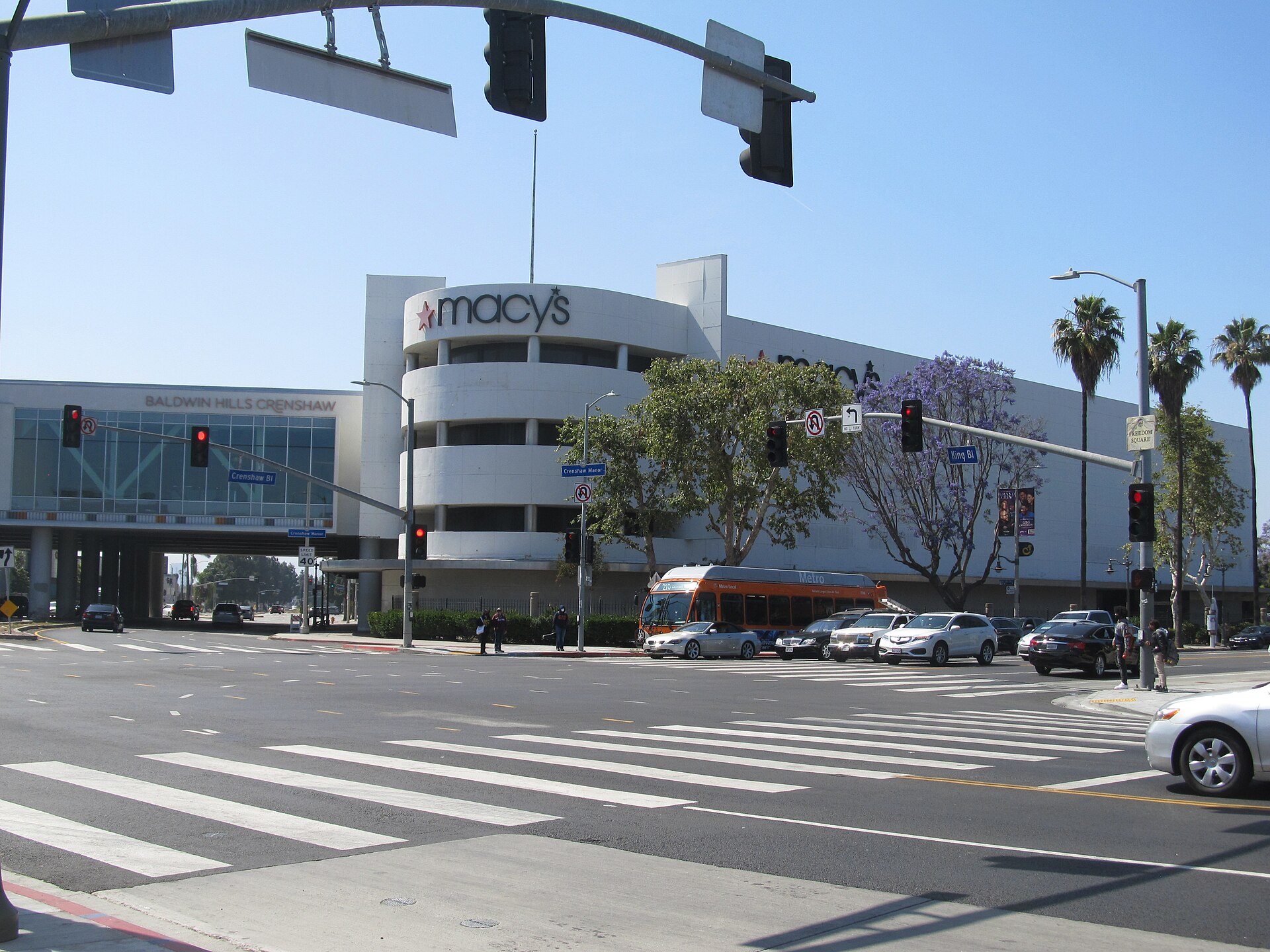 Baldwin Hills Crenshaw Plaza seen across the intersection of Crenshaw Boulevard and Martin Luther King Jr. Boulevard on a sunny day