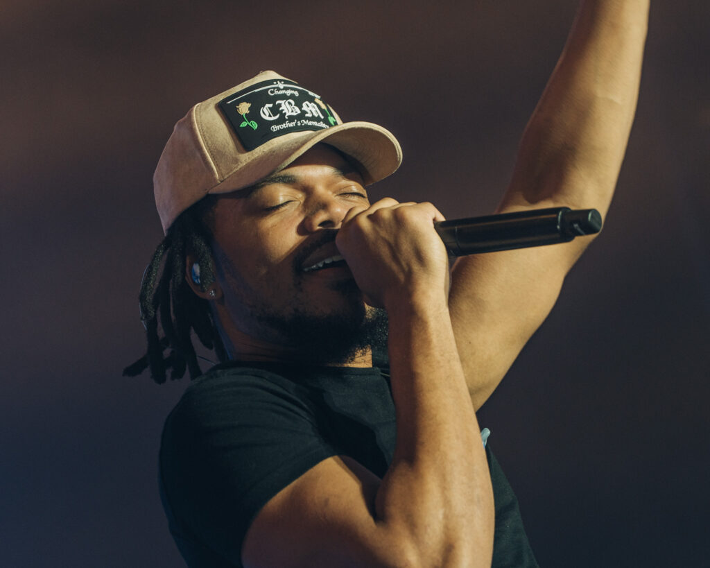 Chance the Rapper at Hollywood Palladium, Los Angeles, September 20, 2026 (13) – The 824 Journal Chance the Rapper holding the microphone up with one arm raised at the Hollywood Palladium.