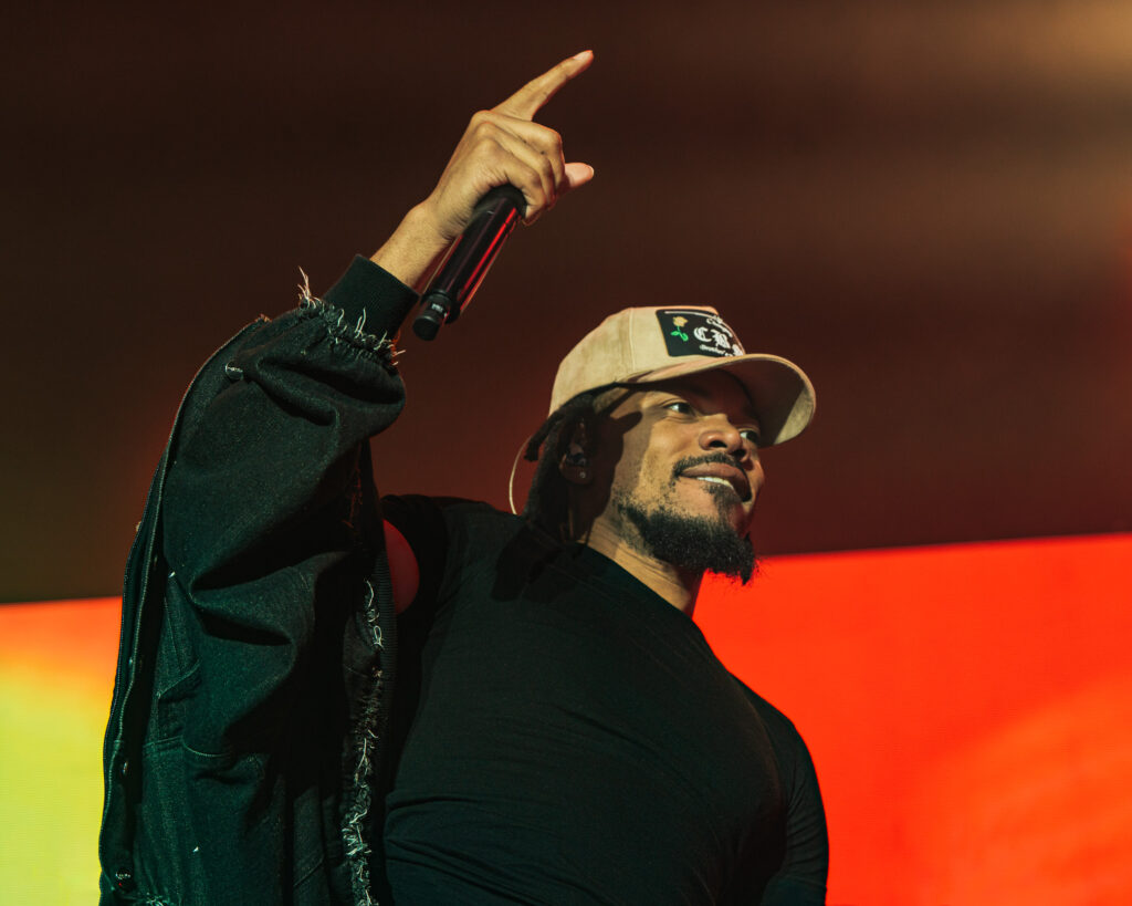 Chance the Rapper at Hollywood Palladium, Los Angeles, September 20, 2026 (5) – The 824 Journal Chance the Rapper pointing upward under orange and red stage lights at the Hollywood Palladium.