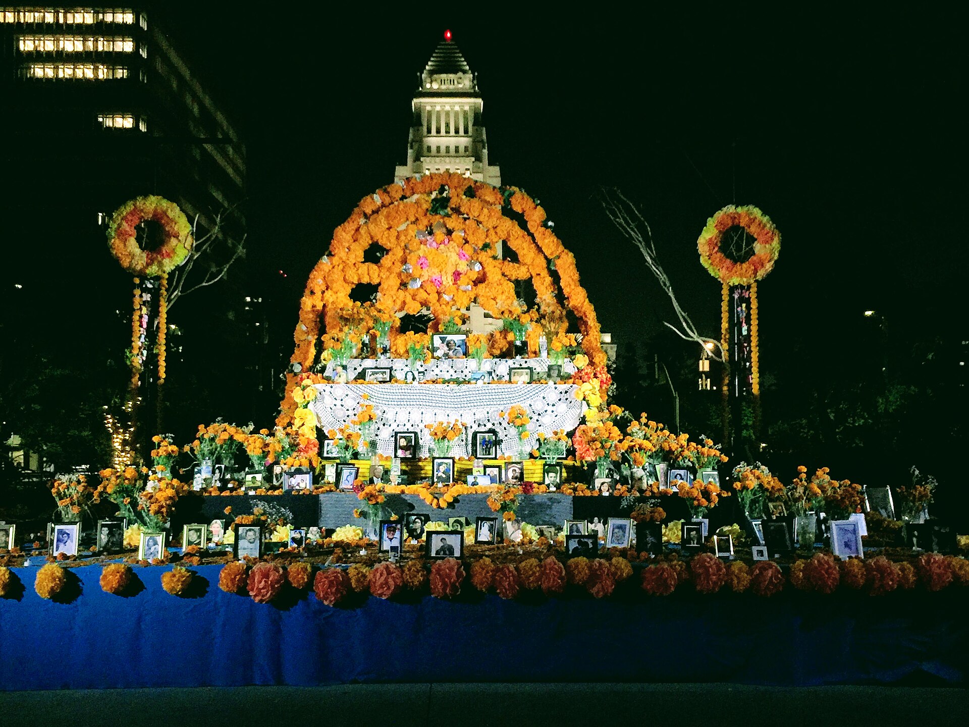 A Día de los Muertos altar at Grand Park in Los Angeles with City Hall in the background