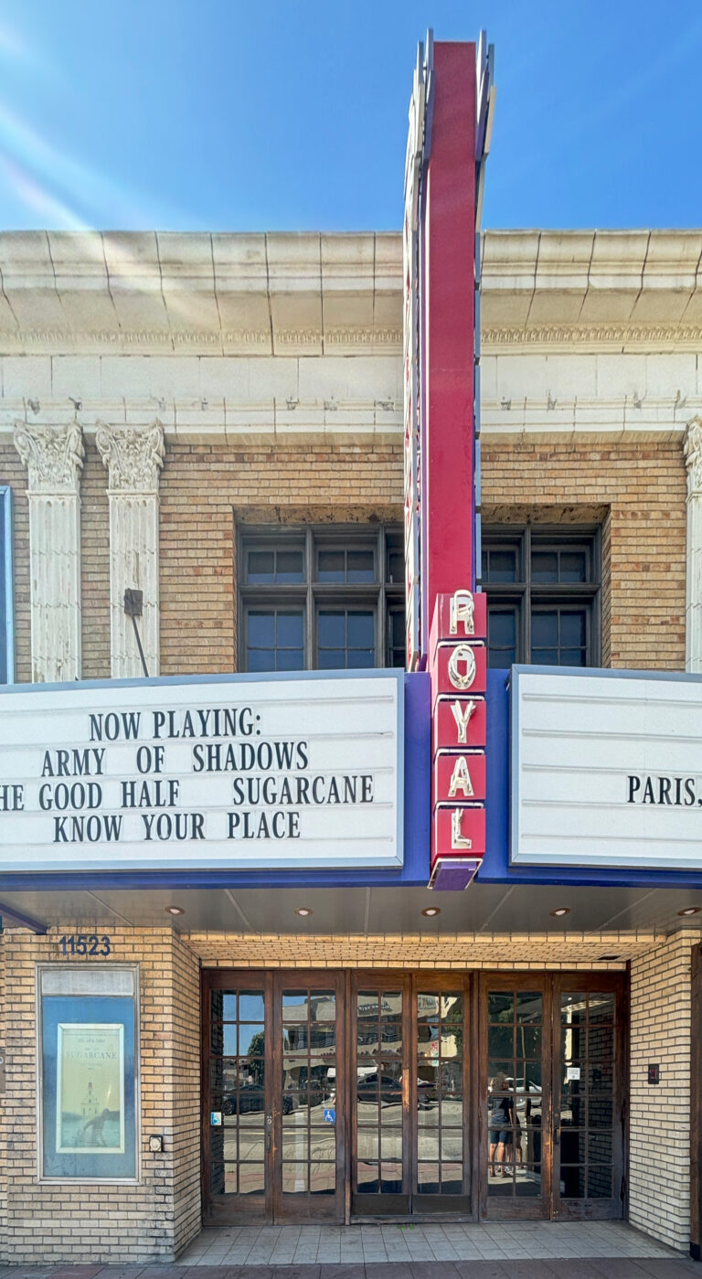 The Royal Theatre on Santa Monica Boulevard in West Los Angeles, with its vertical red ROYAL sign and marquee
