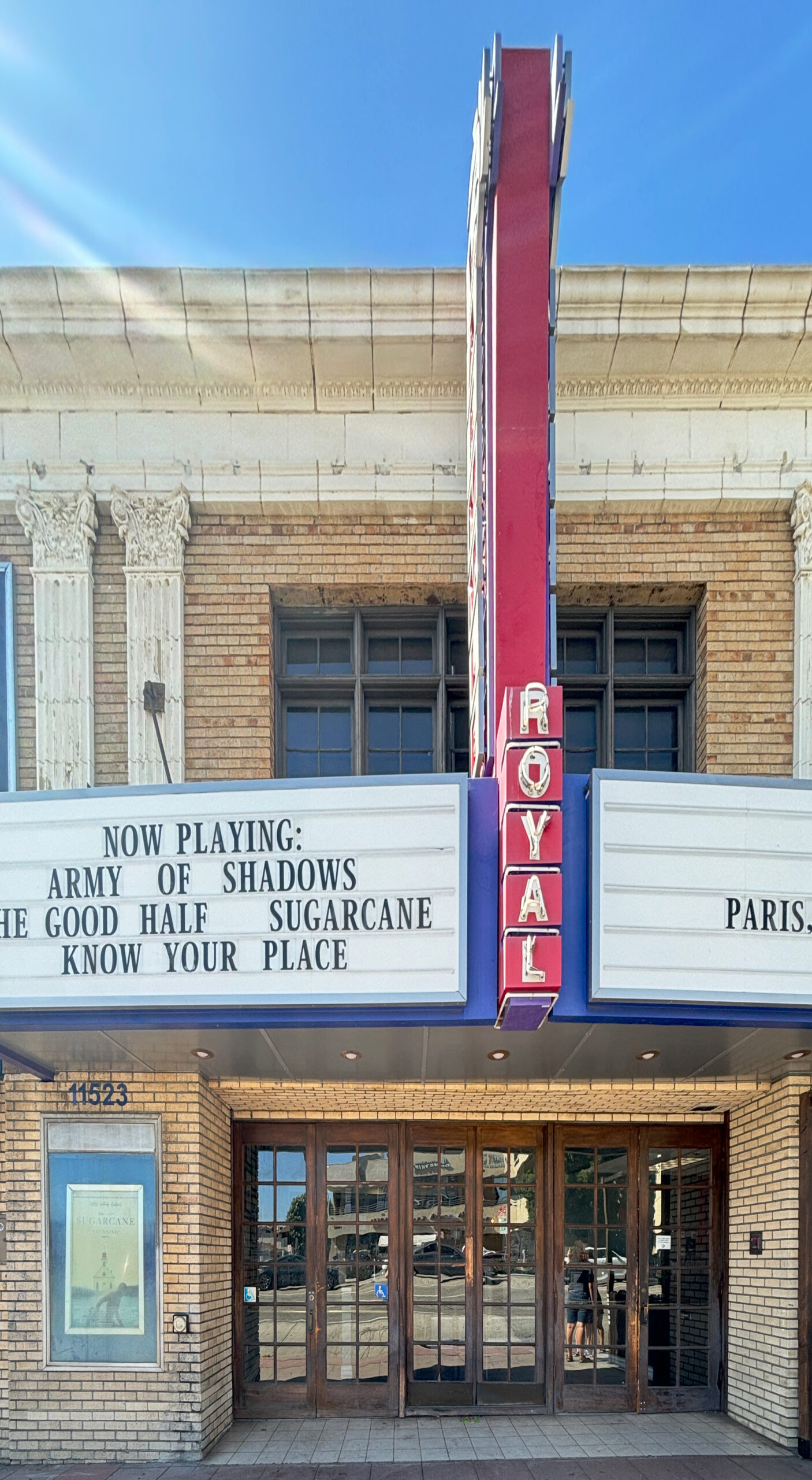The Royal Theatre on Santa Monica Boulevard in West Los Angeles, with its vertical red ROYAL sign and marquee