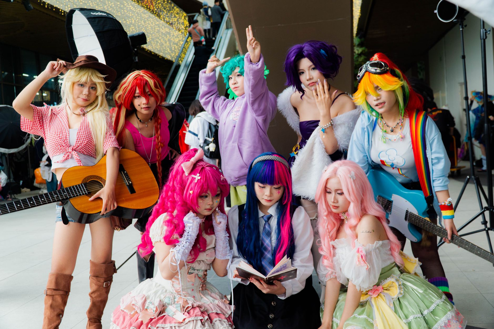 colorful anime cosplay group with instruments