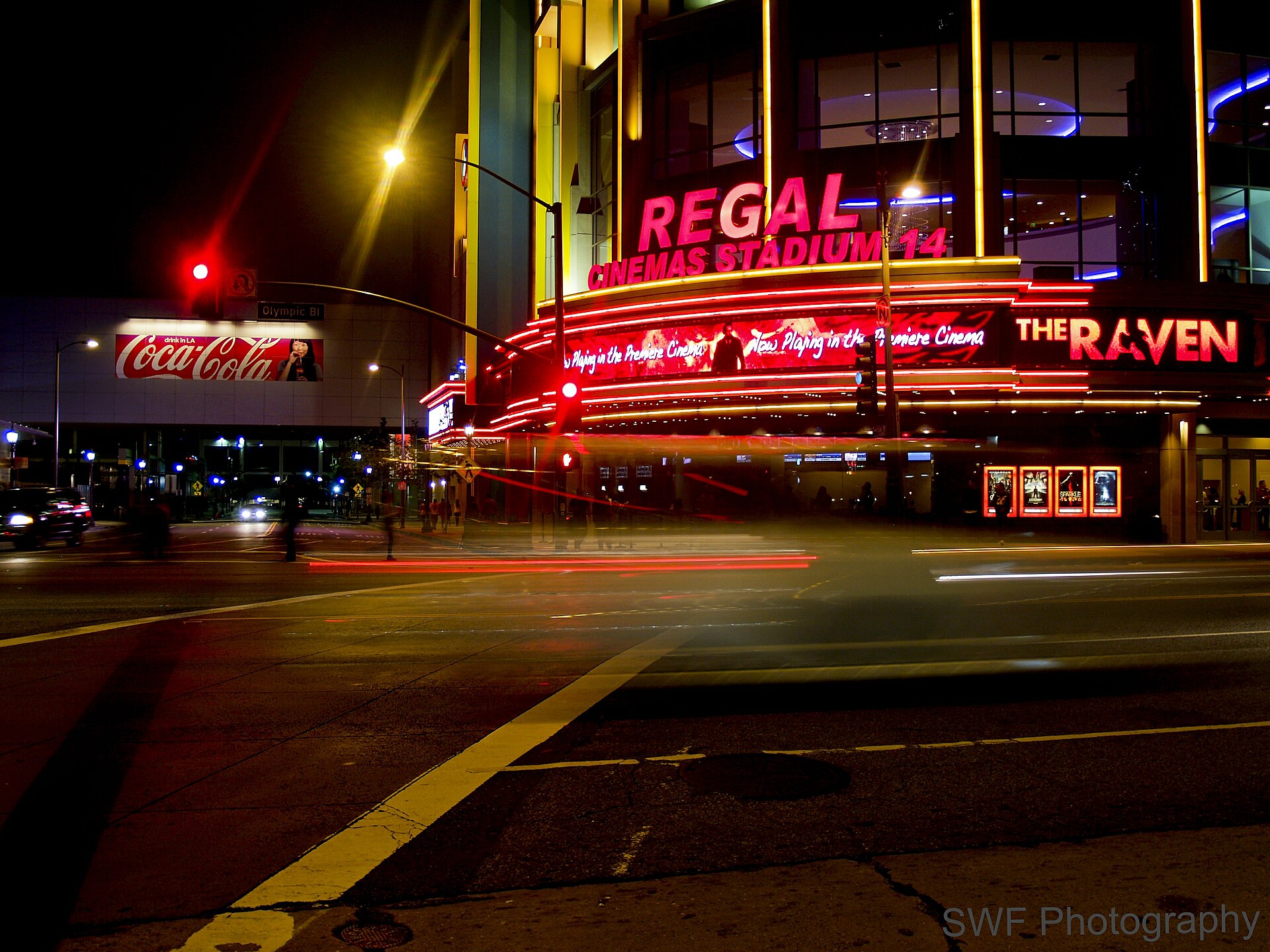 The lit Regal Cinemas sign and marquee at L.A. Live in downtown Los Angeles at night