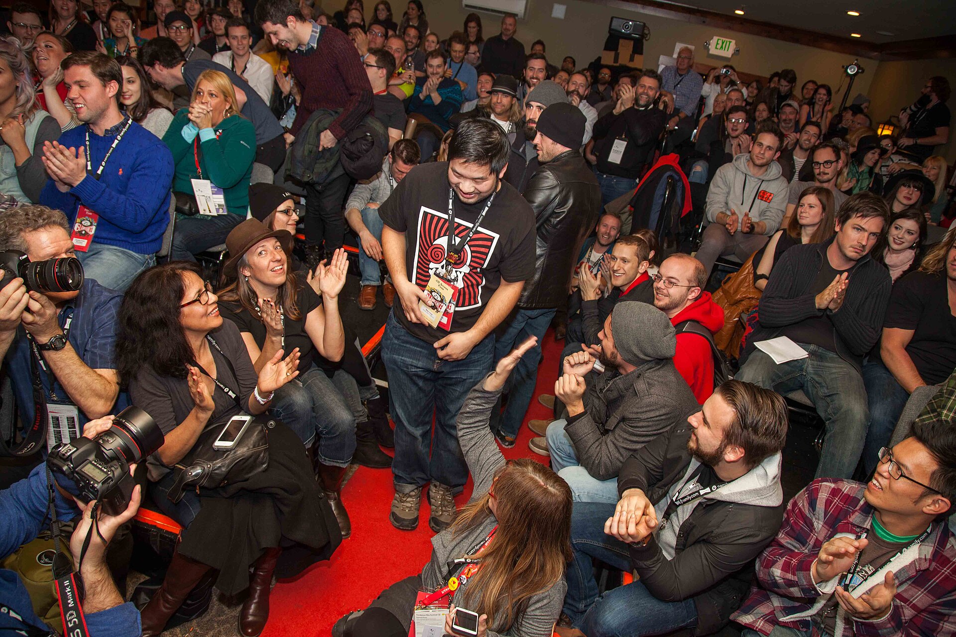 A packed, cheering audience seated on the floor and in rows at the 2015 Slamdance Film Festival award ceremony