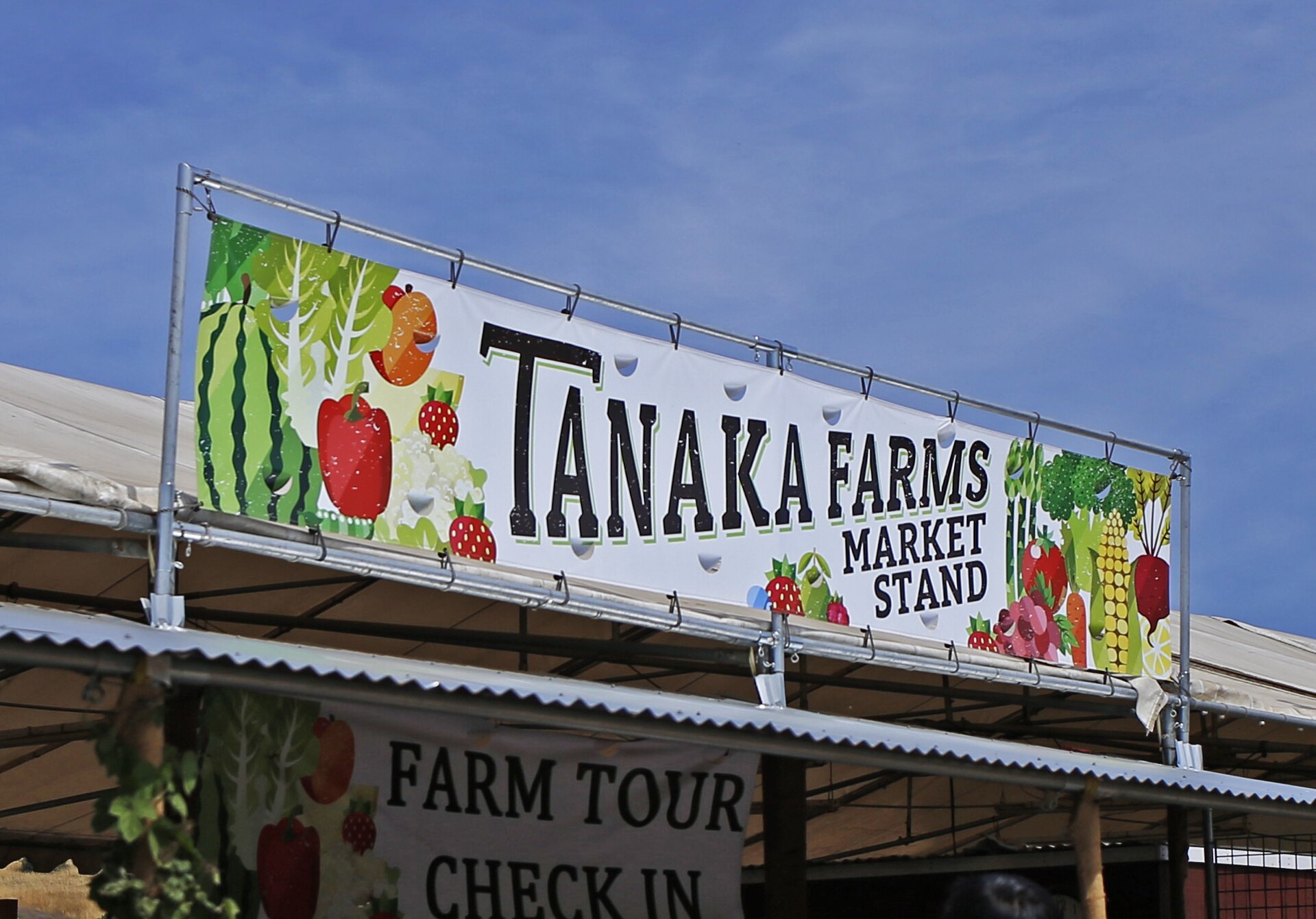 The Tanaka Farms market stand sign in Irvine