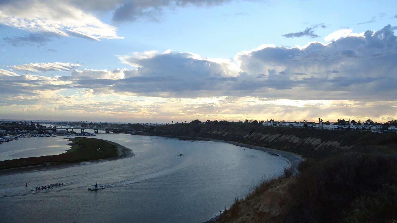 Upper Newport Bay in Newport Beach under a partly cloudy sky