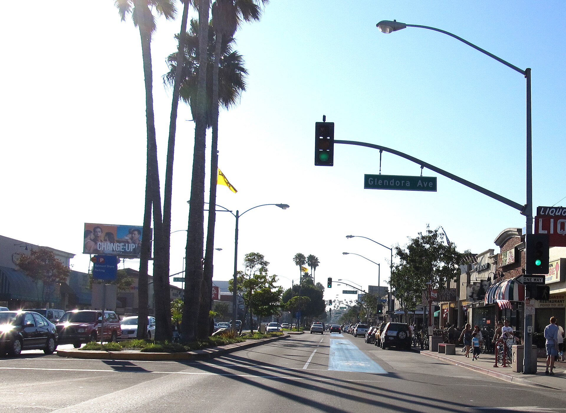 Palm trees, storefronts and a traffic signal along Second Street in Belmont Shore, Long Beach