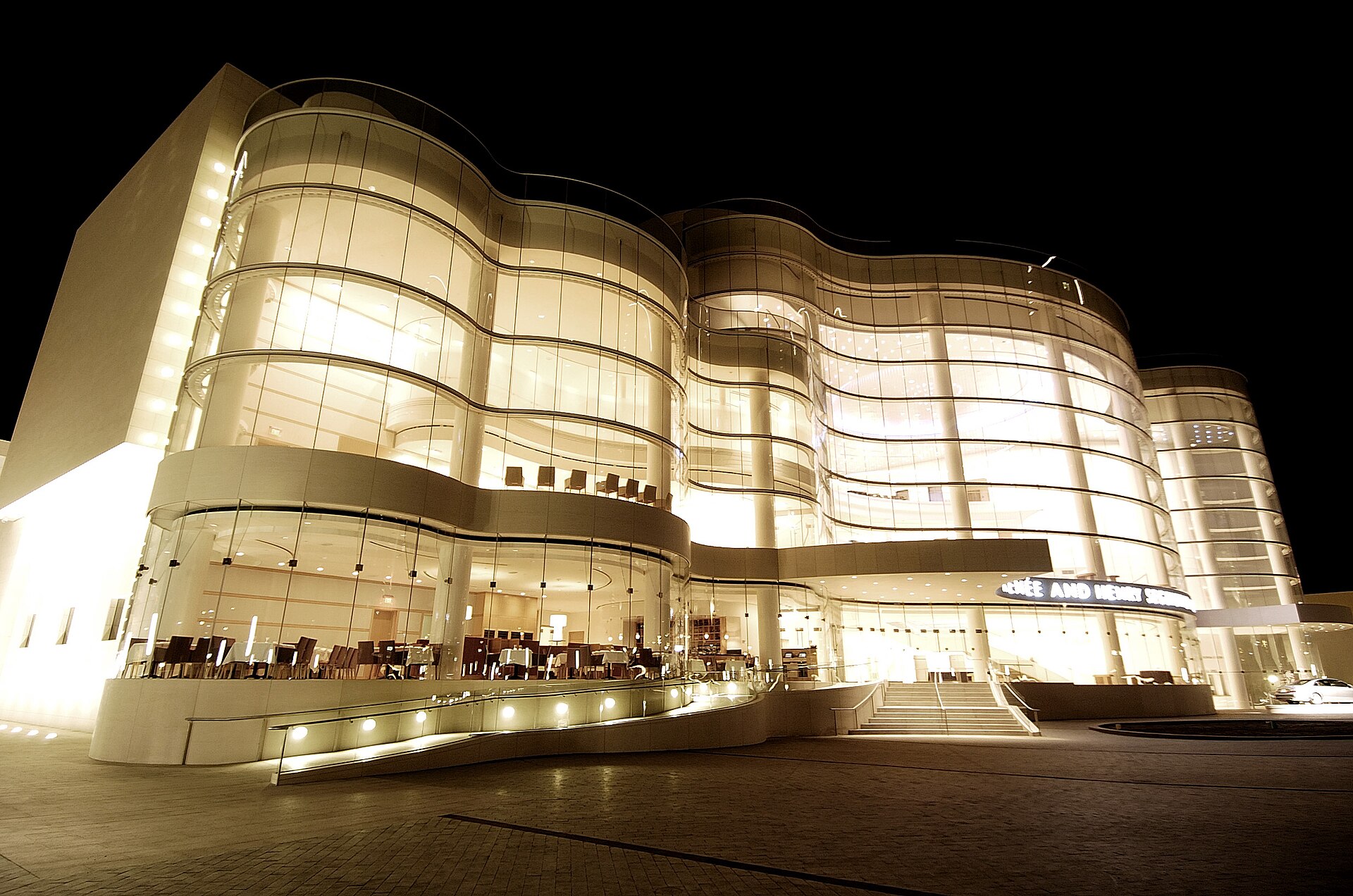 The glass facade of the Renée and Henry Segerstrom Concert Hall in Costa Mesa lit up at night